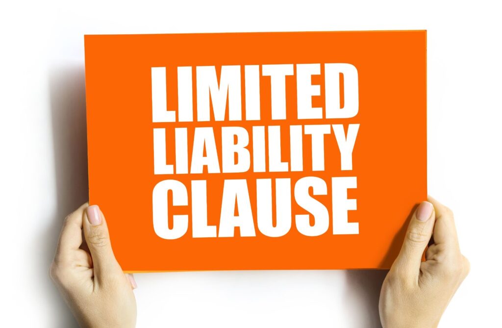 Two hands holding an orange square sign which reads "limited liability clause". Topic: coaching agreement