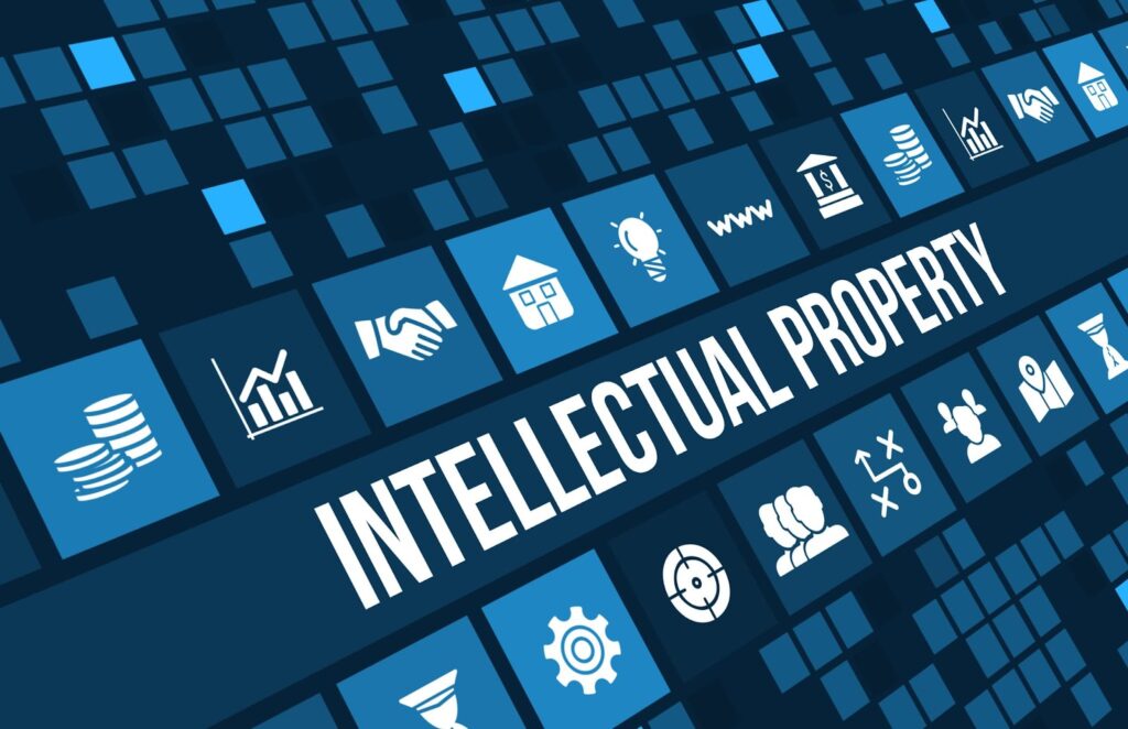 The word "intellectual property" in bold white text surrounded by different shades of blue box patterns with different pictures images on the boxes. Topic: coaching agreement