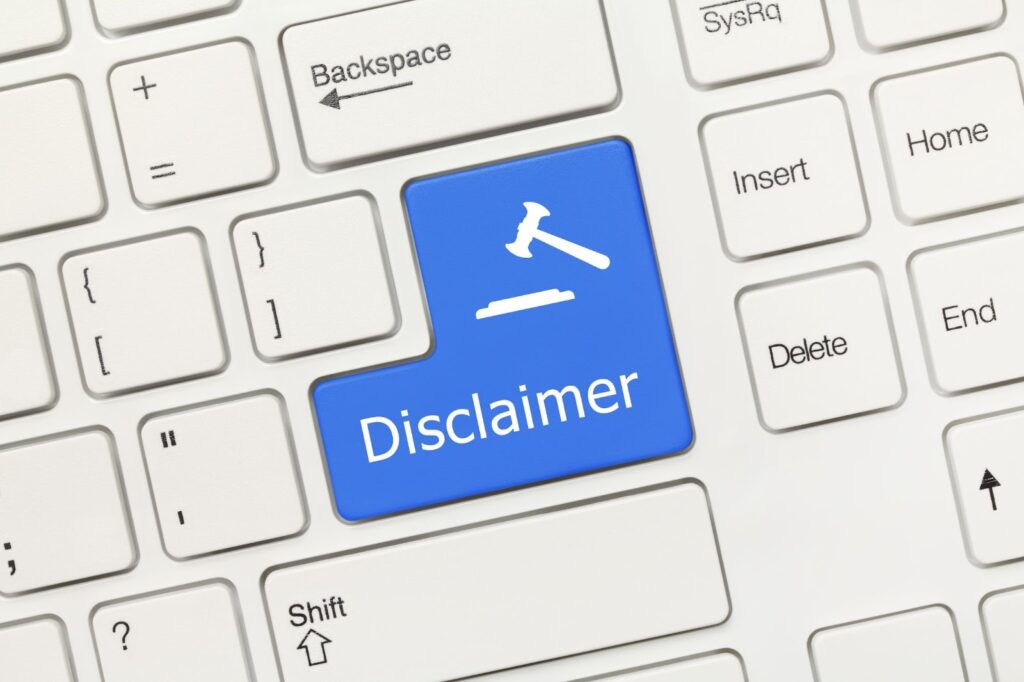 Zoomed in image of white computer keyboard with one button colored blue which reads "Disclaimer". Topic: legal disclaimers for online businesses