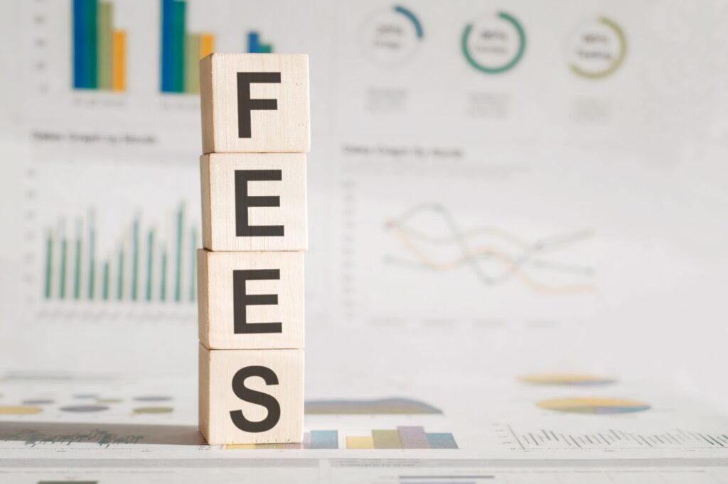 The word 'fees' written on blocks in vertical direction. Topic: coaching agreement